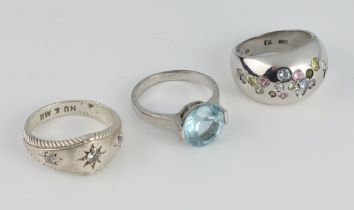 A silver dress ring size M, 2 others sizes L 1/2 and P