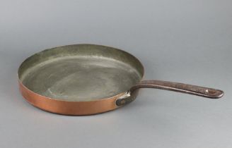 A 19th Century copper frying pan with earls coronet above a W, having a steel handle 33cm