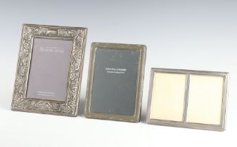 A rectangular silver photograph frame London 1975 14cm x 10cm, 2 others