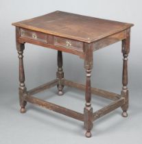 An 18th Century oak side table with geometric moulding, fitted a frieze drawer and raised on