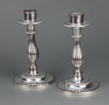 A pair of impressive silver plated baluster candle holders 27cm