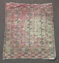 A blue and red ground Bokhara rug with 15 octagons to the centre 111cm x 91cm The rug shows signs of