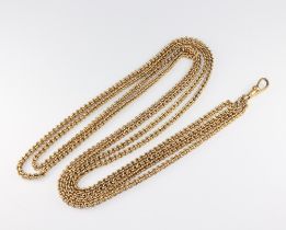 A yellow metal muff chain with clasp, 146cm, 61 grams