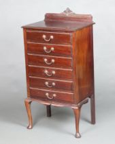 An Edwardian mahogany music chest with raised back, fitted 6 drawers, raised on cabriole supports