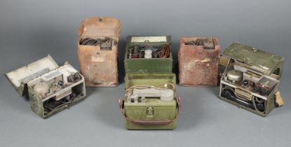 Five military field telephone sets and a power supply comprising two USA Signal Corps EE-8-B, two
