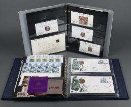 A collection of penny red stamps contained in a blue ring bound album together with an album of