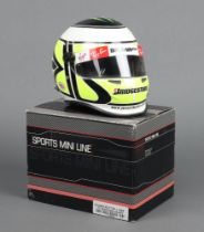 Jensen Button, a half scale Formula 1 mini helmet for Team Brawn 2009, signed by Jensen Button,