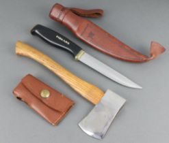 Fiskars a skinning knife with 12cm blade and leather scabbard together with a hatchet with oak shaft