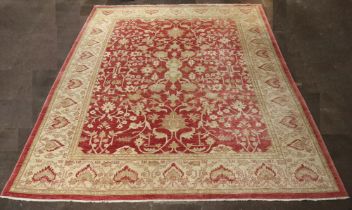 A Caucasian style pink and cream floral patterned carpet 452cm x 371cm