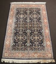 A Persian blue and pink ground floral patterned rug within a multi row border 281cm x 187cm Stains