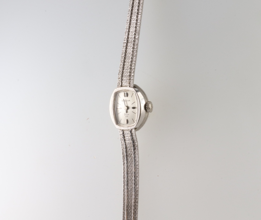 A lady's Bulova Dior 23 white metal 14k wristwatch and bracelet, gross weight 14 grams This watch is