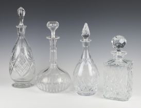 A cut glass square spirit decanter and stopper and 3 mallet shaped ditto