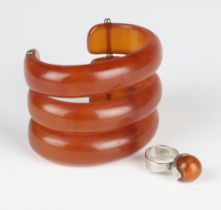 A stylish Bakelite 3 division bangle together with a ditto silver ring