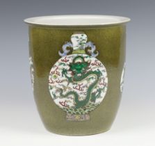 An 18th Century style green ground oviform jardiniere decorated with vases bearing a 6 character