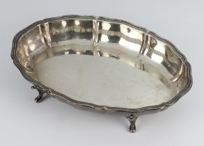 A silver shaped dish on scroll feet Sheffield 1940, 347 grams, 25cm