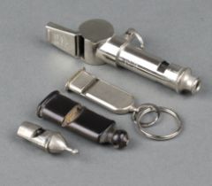 An Acme Thunderer and Acme City double whistle, a horn whistle and 2 other whistles