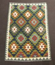 A black, white and green ground Maimana Kilim rug 144cm x 97cm