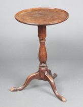 A 19th Century circular dish top wine table raised on a turned and tripod base 72cm h x 47cm diam.