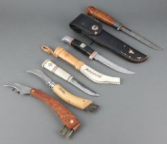A skinning knife with 14cm blade, a Brand 69 model 1910 skinning knife with leather scabbard, an