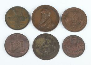 A collection of 18th and 19th Century brass or bronze medals and advertisers' tokens