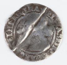 A silver six pence coin of Elizabeth I, folded and then reflattened