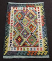 A white and green ground Chobi Kilim with diamond decoration to the centre within multi row border