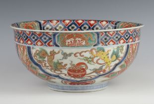 A 19th Century Chinese deep Imari bowl decorated with panels of dragons and flowers 25cm