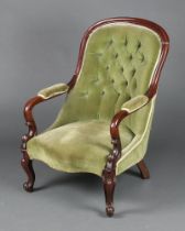 A William IV mahogany show frame open arm chair upholstered in green buttoned material, the seat