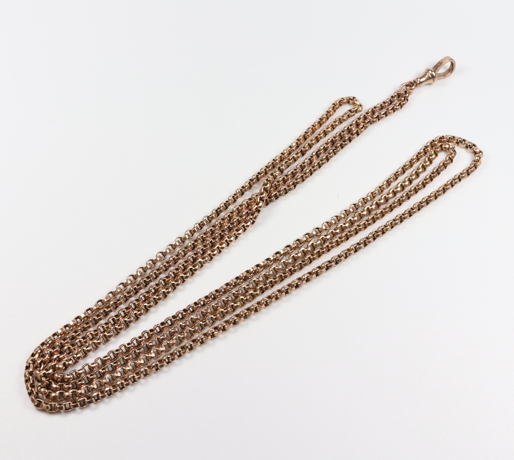 A yellow metal 9ct muff chain, 124 cm, 25 grams