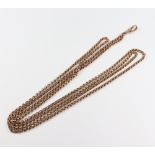 A yellow metal 9ct muff chain, 124 cm, 25 grams