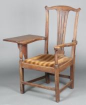 An 18th/19th Century elm slat back carver chair with vase shaped back, having a later table flap