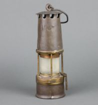 A miner's safety lamp marked Patent 136F