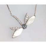 A white metal dragonfly necklace with mother of pearl wings set with brilliant cut diamonds, approx.