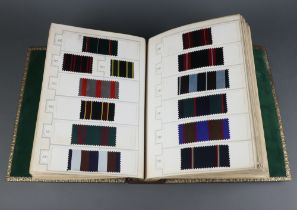 An album 19th/20th Century fabric samples contained in a leatherette bound volume