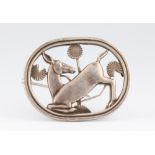 An Arno Malinowski for Georg Jensen Sterling silver kneeling deer brooch with stylised flowers ,