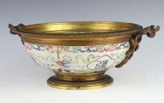 A 19th Century Chinese famille rose bowl decorated with bats, scrolls, fish and characters, now with