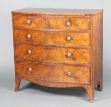 A 19th Century mahogany bow front chest of 2 short and 3 long drawers with replacement brass ring