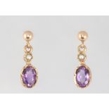 A pair of 9ct yellow gold amethyst ear studs 1.3 grams