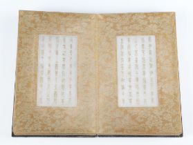 An early 20th Century Buddha Sutra book with gilt tang inscriptions, the title page with Uryu