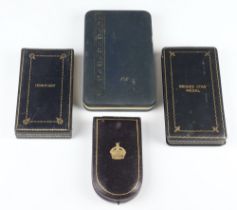 A Military Cross box, a Legion of Merit Box, a bronze star medal box and a USA medal box