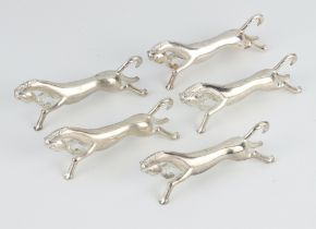 Five silver plated knife rests in the form of horses