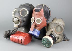 A child's Second World War Mickey Mouse gas mask (some perishing to the rubber), a WWII Civil