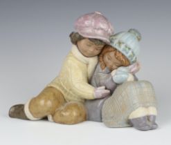 A Lladro matt figure of a girl and boy 2441 20cm