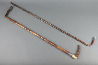 A silver mounted walking crop with horn handle together with a silver mounted bamboo effect