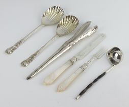 A pair of Edwardian hammered pattern silver glove stretchers, 2 serving spoons, a knife, fork and