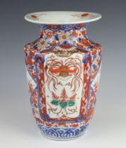 A 19th Century Imari oviform vase decorated with panels of flowers with flared neck 27cm
