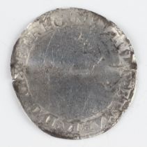 A silver three pence coin of Elizabeth I, folded and then reflattened