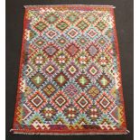 An orange, purple, blue and green ground Chobi Kilim rug with all over diamond design 197cm x 130cm