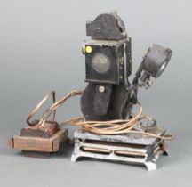 A Pathe Baby 1922 9.5mm projector, converted to a battery (corroded)