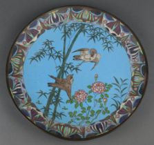 A Japanese blue ground cloisonne enamelled plate decorated with birds amidst branches 30cm The